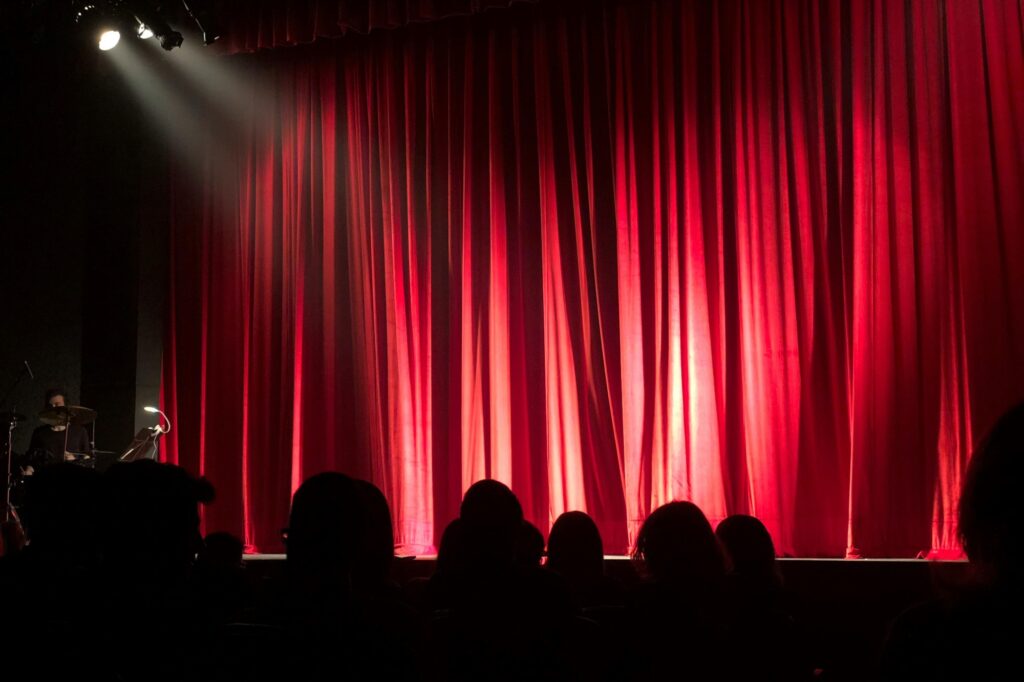 People at a theatre waiting for the show to start
