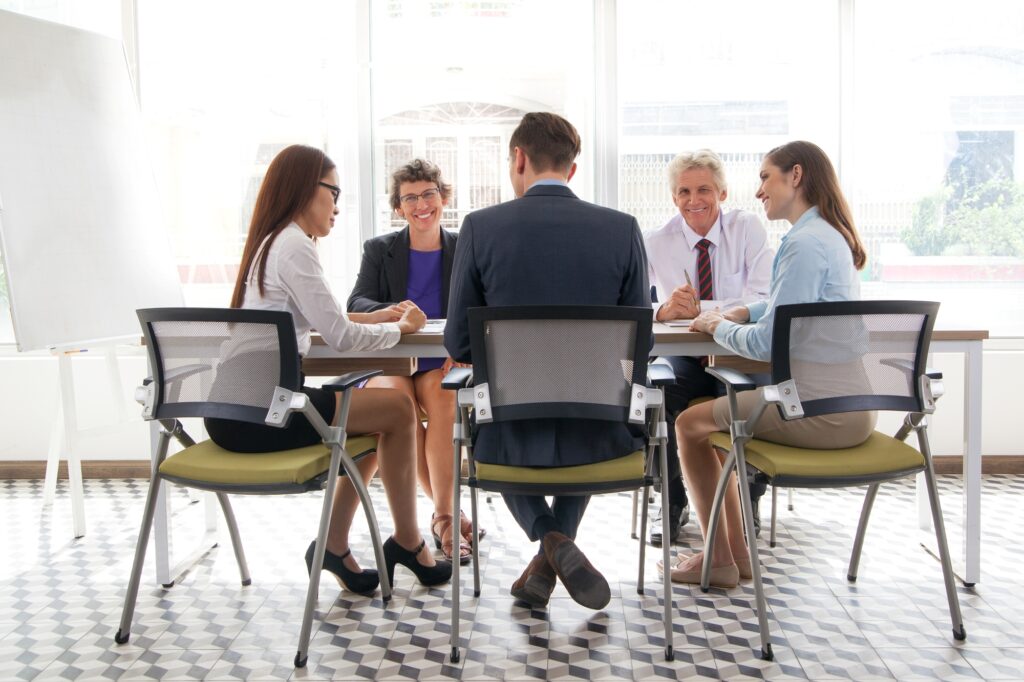 The Office Moving Team in a meeting